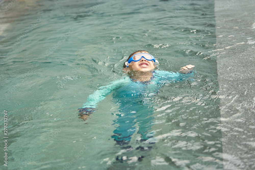 Boy play water and floats alone in safty concept