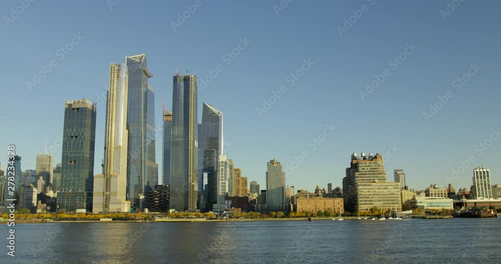 Travelling On Beautiful River With Impressive New York Skyline And Massive Beautiful Skyscrapers In Classic Manhattan NYC Travelling On Beautiful River With Impressive New York Skyline And Massive Beautiful Skyscrapers In Classic Manhattan NYC