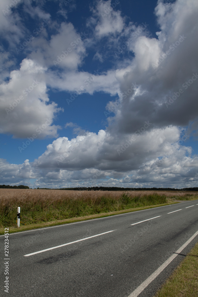 Mecklenburg Vorpommern. Countryside. Fields. Road clouds Mecklenburg Vorpommern. Countryside. Fields. Road clouds