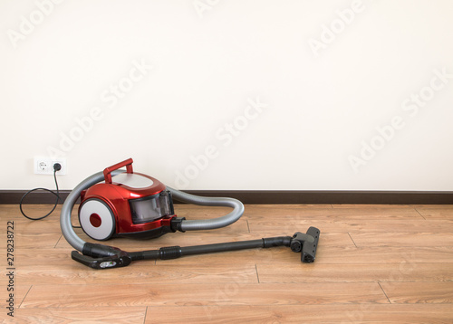 vacuum cleaner is standing on the floor