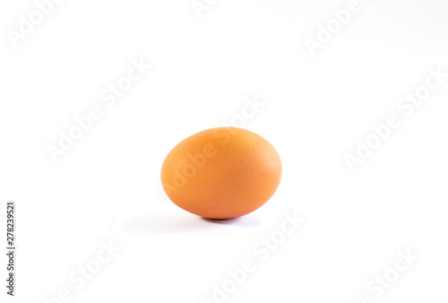 Closeup of raw egg on white background