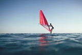 Windsurfing, low angle view of surfer sailing on the sea	