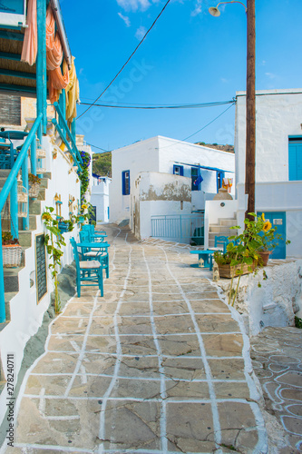 Street view of Chorio village with paved alleys and traditional cycladic architecture in Kimolos island in Cyclades, Greece © Haris Andronos