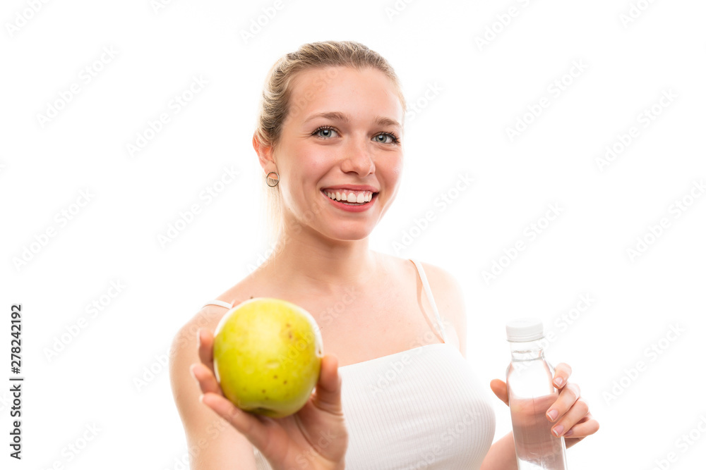 Young blonde woman with an apple and a bottle of water Young blonde woman with an apple and a bottle of water