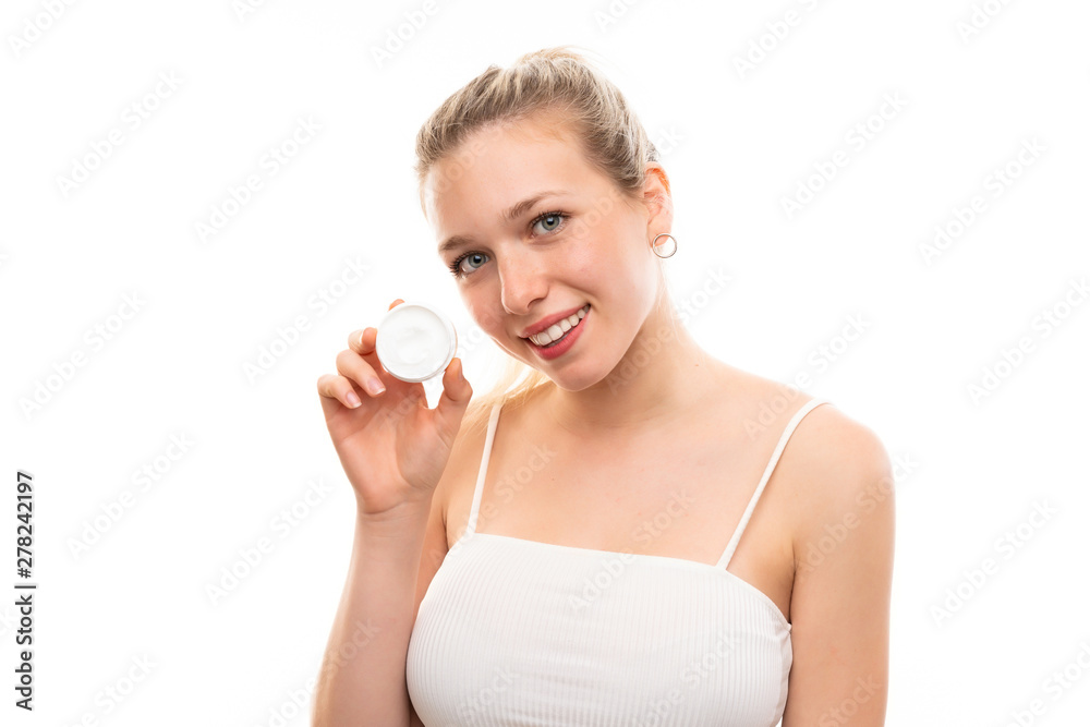 Young blonde woman over isolated white background with moisturizer Young blonde woman over isolated white background with moisturizer