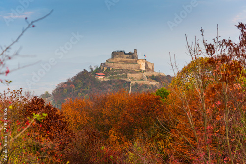 Autumn landscape with Deva citadel, view from the hill photo