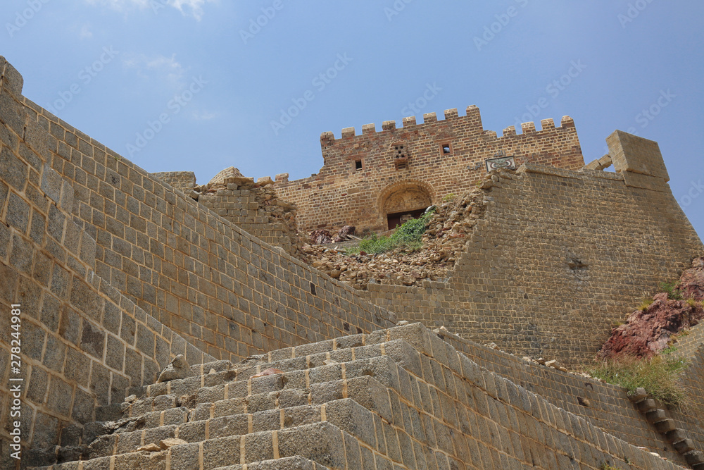 Part of the ruins of the historical castle  (Alqahera ) because of the war in Taiz  city, Yemen .
