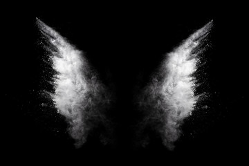White powder explosion on black background. Colored cloud. Colorful dust explode. Paint Holi.