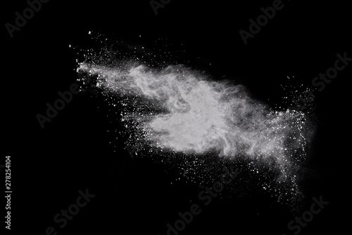 White powder explosion on black background. Colored cloud. Colorful dust explode. Paint Holi.