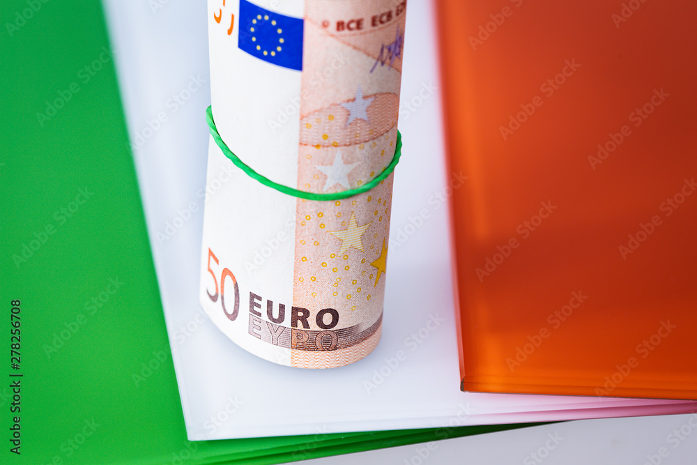Irish flag with euro banknotes Irish flag with euro banknotes