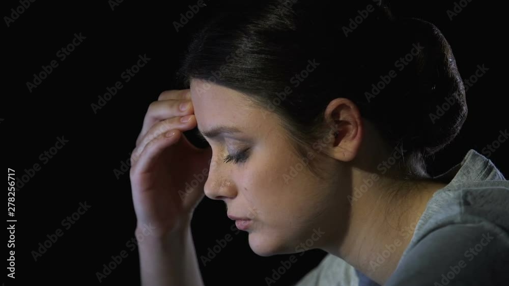 Young woman suffering headache, feeling depression and exhaustion, closeup Young woman suffering headache, feeling depression and exhaustion, closeup