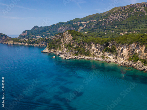 Rocky coastline at Corfu island. Turquoise clear water. Aerial summer photo from drone. Greece.