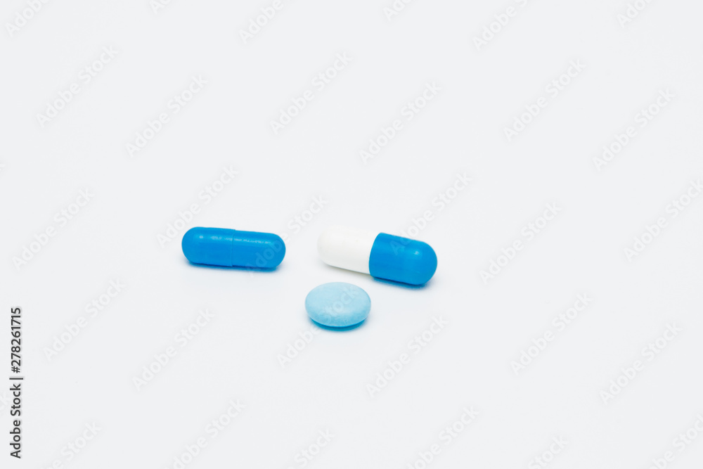 Macro view of capsule pill and tablet isolated over white background Macro view of capsule pill and tablet isolated over white background