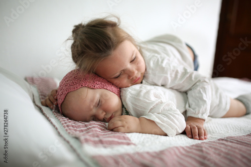 Toddler Girl Hugs a Sleeper Cute little baby