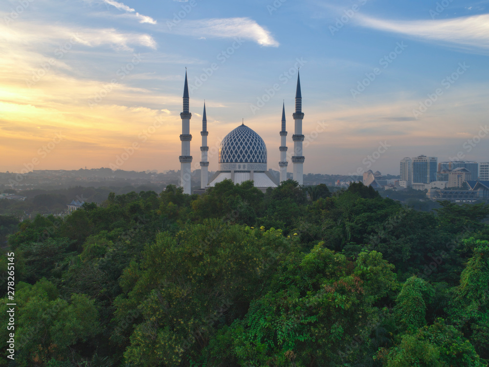Aerial view of Shah Alam mosque with garden landscape design and Putrajaya Lake, Putrajaya. The most famous tourist attraction in Selangor city, Malaysia