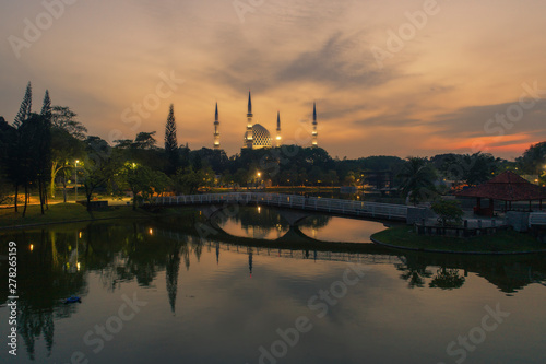 Aerial view of Shah Alam mosque with garden landscape design and Putrajaya Lake, Putrajaya. The most famous tourist attraction in Selangor city, Malaysia