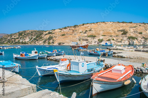 Traditional colorful fishing boats in Saint Nicolas (Agios Nikolas) bay in Kimolos island, Cyclades, Greece