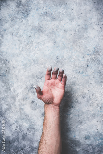 Man hand covered with paint