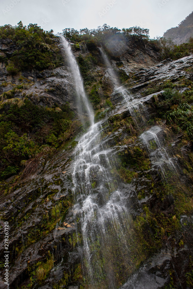 Waterfall at Milford sound. Fjordland. new Zealand. Fog. Misty Waterfall at Milford sound. Fjordland. new Zealand. Fog. Misty