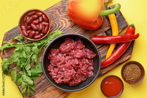 Ingredients for chili con carne on color background photo