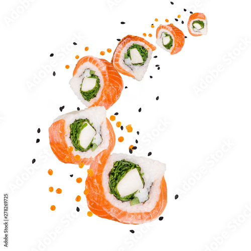 Pieces of delicious japanese sushi frozen in the air. Isolated on white background
