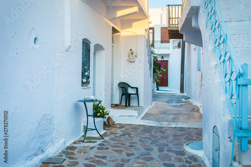 Street view of Plaka village with paved alleys and traditional cycladic architecture in Milos island in Cyclades  Greece