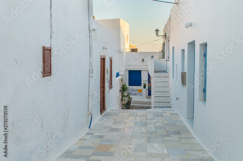 Street view of Plaka village with paved alleys and traditional cycladic architecture in Milos island in Cyclades, Greece