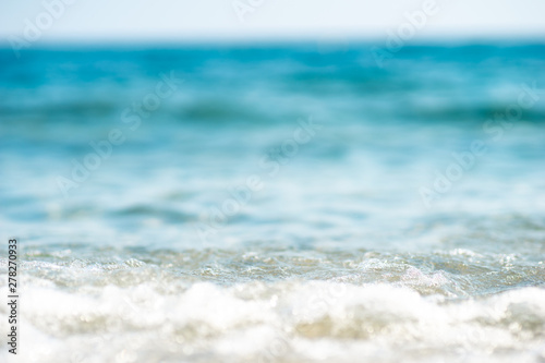 Fototapeta Naklejka Na Ścianę i Meble -  close up of a wave rolling onto the beach