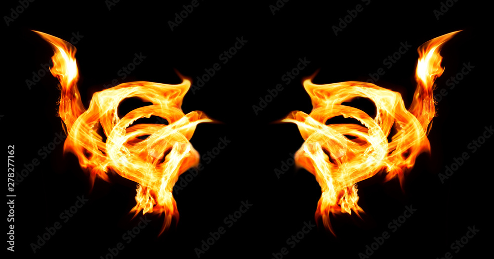 Fototapeta premium Burning fire wings on isolated black background