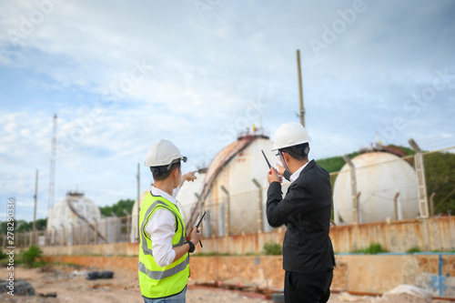Engineer and manager with oil refinery industry plant background  ,  Industry 4.0 concept image