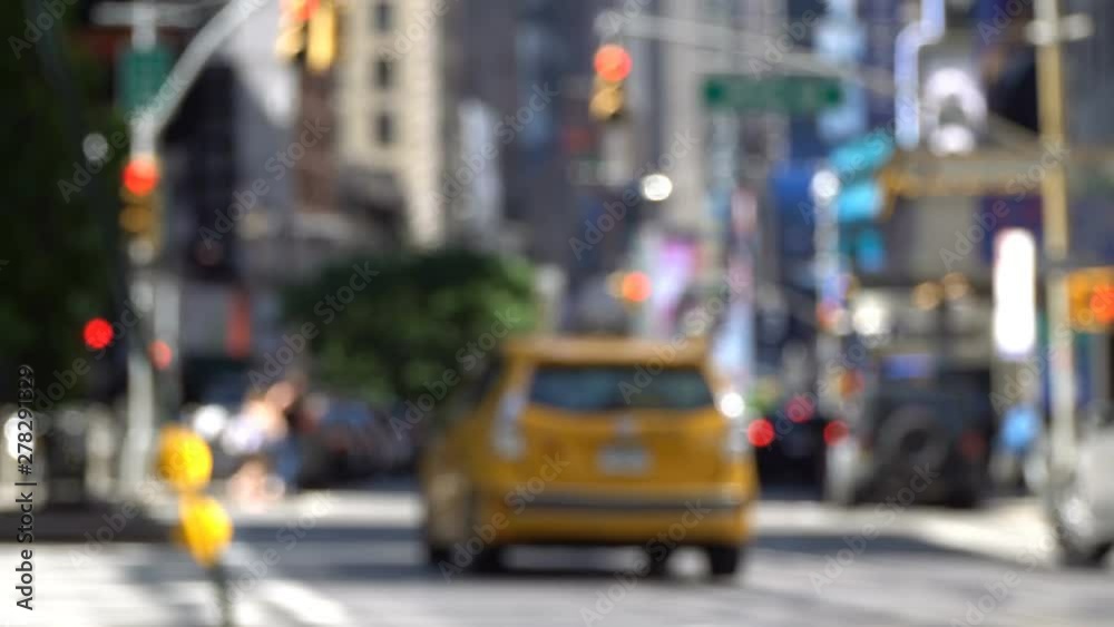 Defocused New York Avenue video background with a yellow NYC taxi getting the green light, Manhattan without much traffic Defocused New York Avenue video background with a yellow NYC taxi getting the green light, Manhattan without much traffic