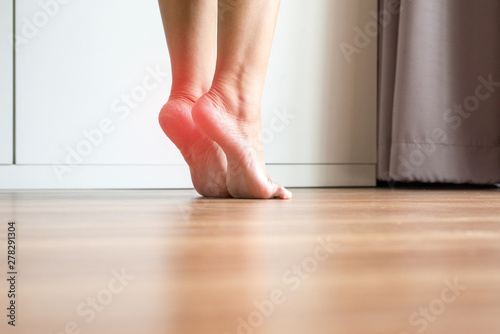 Women stretching and tiptoe foot in bedroom,Feet soles massage for plantar fasciitis,Close up