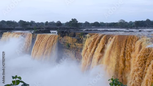 Large water volume flowing over beautiful Chitrakote Falls, Chhattisgarh, India photo