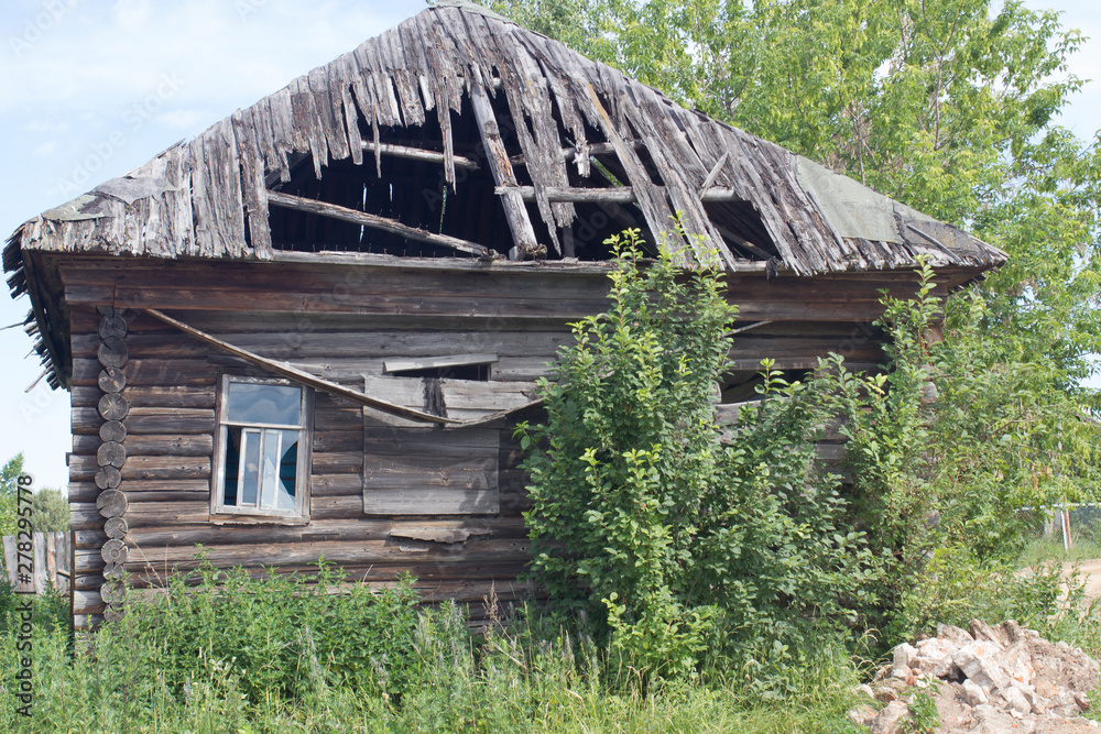 old abandoned wooden houses in Russian village view in summer old abandoned wooden houses in Russian village view in summer