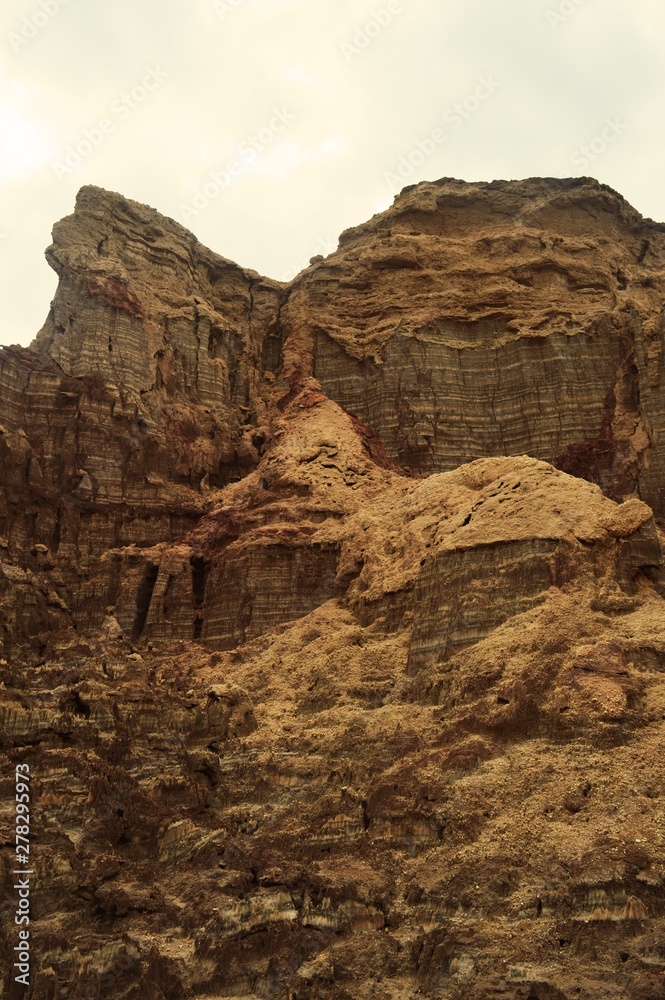 Fototapeta premium Ethiopia. The parched sea. The rocks in this photo were made of salt and at the top you can see the silt. 