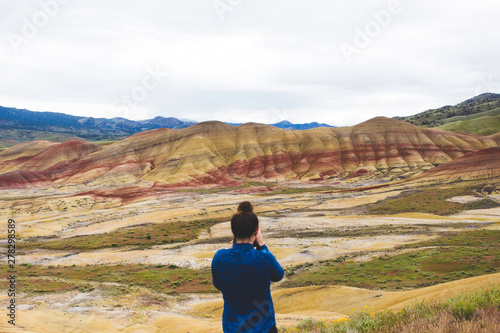 A photographer shooting the Painted Hills, Oregon photo