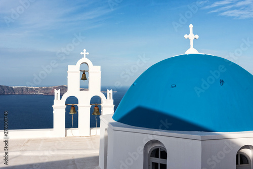 Orthodox church with blue dome on Santorini photo