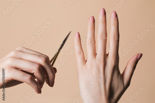 Woman Holding Nail Scissors