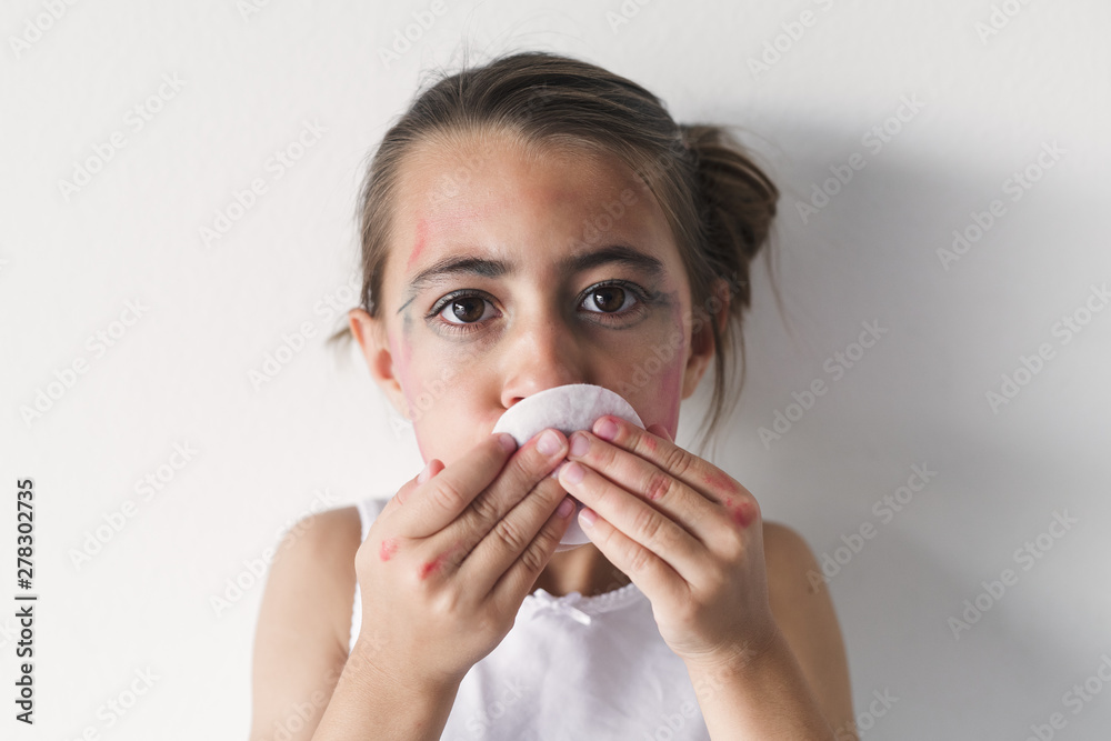 A Girl Removing Her Makeup With A White Pad A Girl Removing Her Makeup With A White Pad