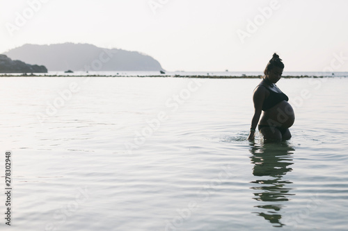 Pregnant Woman at Beach photo