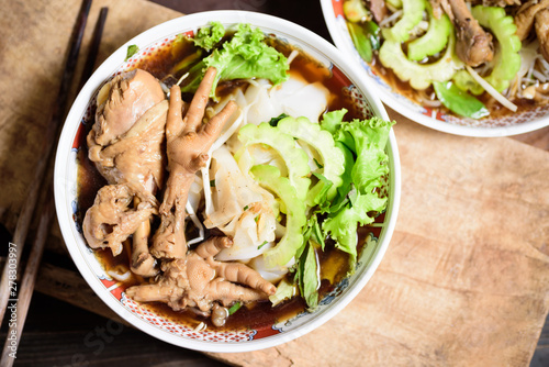 Rice noodles soup with stewed chicken wing and feet, Asian food