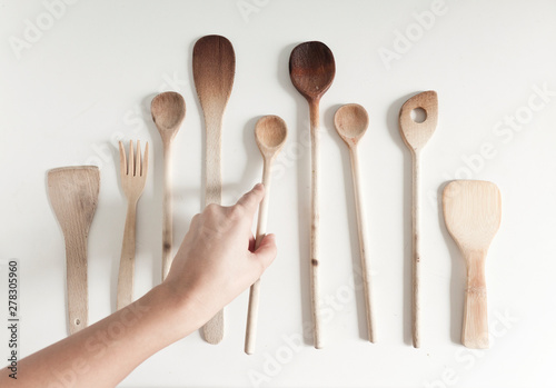 Choosing a wooden spoon photo