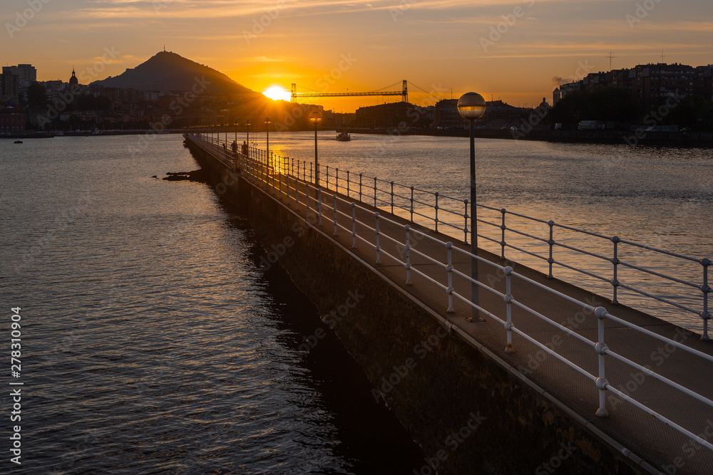 Panorama of Portugalete and Getxo with Hanging Bridge of Bizkaia at sunset from La Benedicta pier, Basque Country, Spain