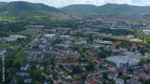 Wallpaper Mural Aerial view of the city Reutlingen in Germany.  Camera pans right across the city, mountains in the background. Panorama view. Torontodigital.ca