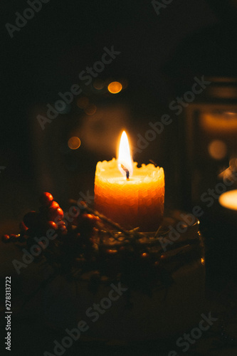 One candle on a black background, a mourning candle