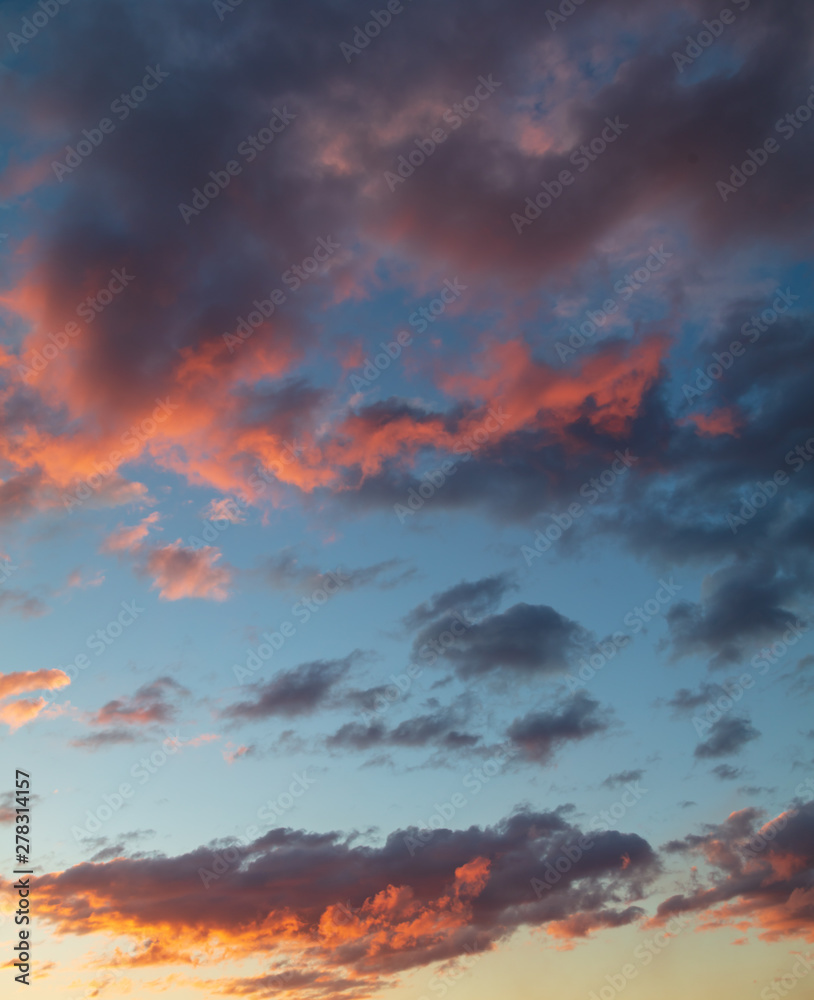 Beautiful clouds at sunset as background