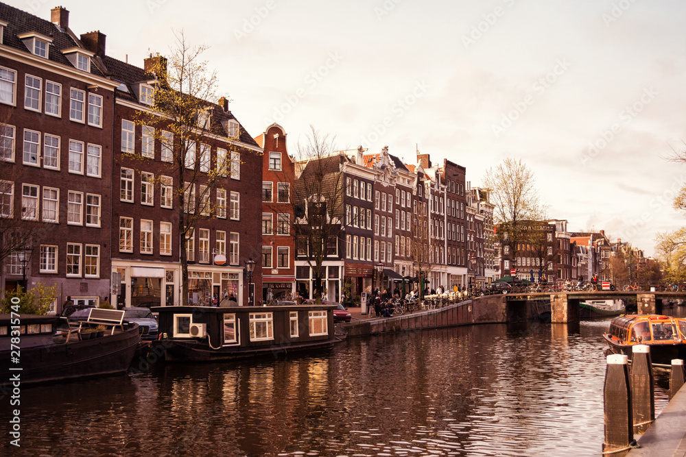 Traditional old buildings and canal in Amsterdam, Netherlands