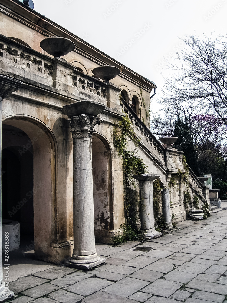 Stone staircase of an old mansion in the Crimea. Decorative fence of stone columns Stone staircase of an old mansion in the Crimea. Decorative fence of stone columns