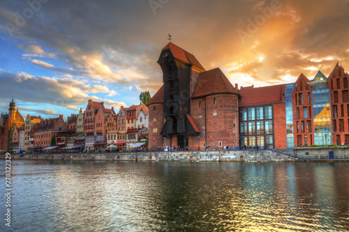 Beautiful port crane and the old town of Gdansk at sunset, Poland.
