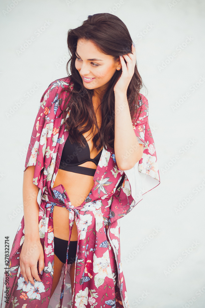 Sexy bikini body woman feeling free with slim stomach and smooth thighs wearing colorful fashion scarf skirt swimwear beachwear showing off weight loss. Laser beauty spa wellness concept. Sexy bikini body woman feeling free with slim stomach and smooth thighs wearing colorful fashion scarf skirt swimwear beachwear showing off weight loss. Laser beauty spa wellness concept.